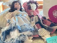 decorative pillows, dolls, and the cat