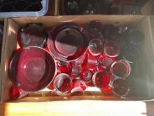 Box of ruby red dishes.