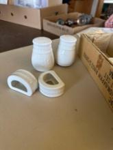 White salt and pepper shaker and napkin rings, serving bowl and platters, etc