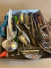 Various kitchen utensils, some with advertising