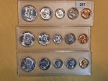 Three brilliant uncirculated US silver coin sets