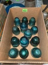 13 Antique, Assorted Sized Green Glass Insulaters.