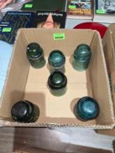 6 Antique, Green Glass Insulaters.