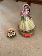 Music box and small flowers in basket