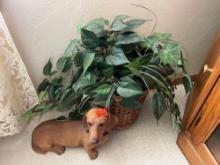 Doggy statue and artificial plant