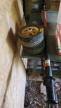 assorted wheels, water meter key, chainsaw pole
