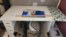 sewing table and items on top of table