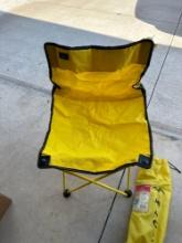 Yellow fold up chair with bag