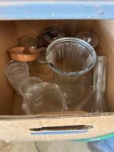 Box of glass vases and water hose and more