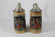 Two small German beer steins.