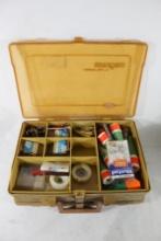 One Plano double sided tackle box with fishing items.