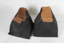 Two nylon and leather shooting rests. In good condition.