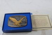 Monetary Mint gold and silver colored belt buckle. In box.