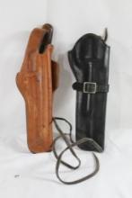 Two leather right handed revolver holsters. Used. Both for 4".