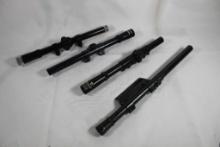 Four 22 cal rifle scopes. One Revelation, one unknown and two Tasco. Used.