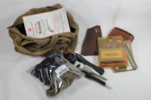 Small zippered canvas bag with miscellaneous shooting items. Used.
