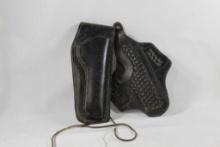 Two black leather right handed belt holsters. Used.