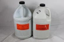Two gallon jugs of military surplus reloading gun powder. One labeled WC857 and one labeled WC860.