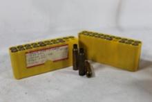 Two plastic yellow ammo boxes of fired 243 Win brass. Count 40, 13 are resized and primed.