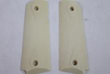 One set of Colt 45 auto Ivory like grip panels. In bag.