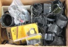 Box of miscellaneous scope covers. Used.