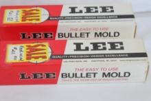 Two Lee wood handled double cavity 230 gr lead ball molds. In factory boxes.