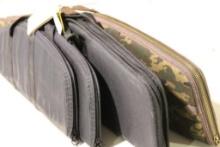 Four soft sided padded rifle cases.
