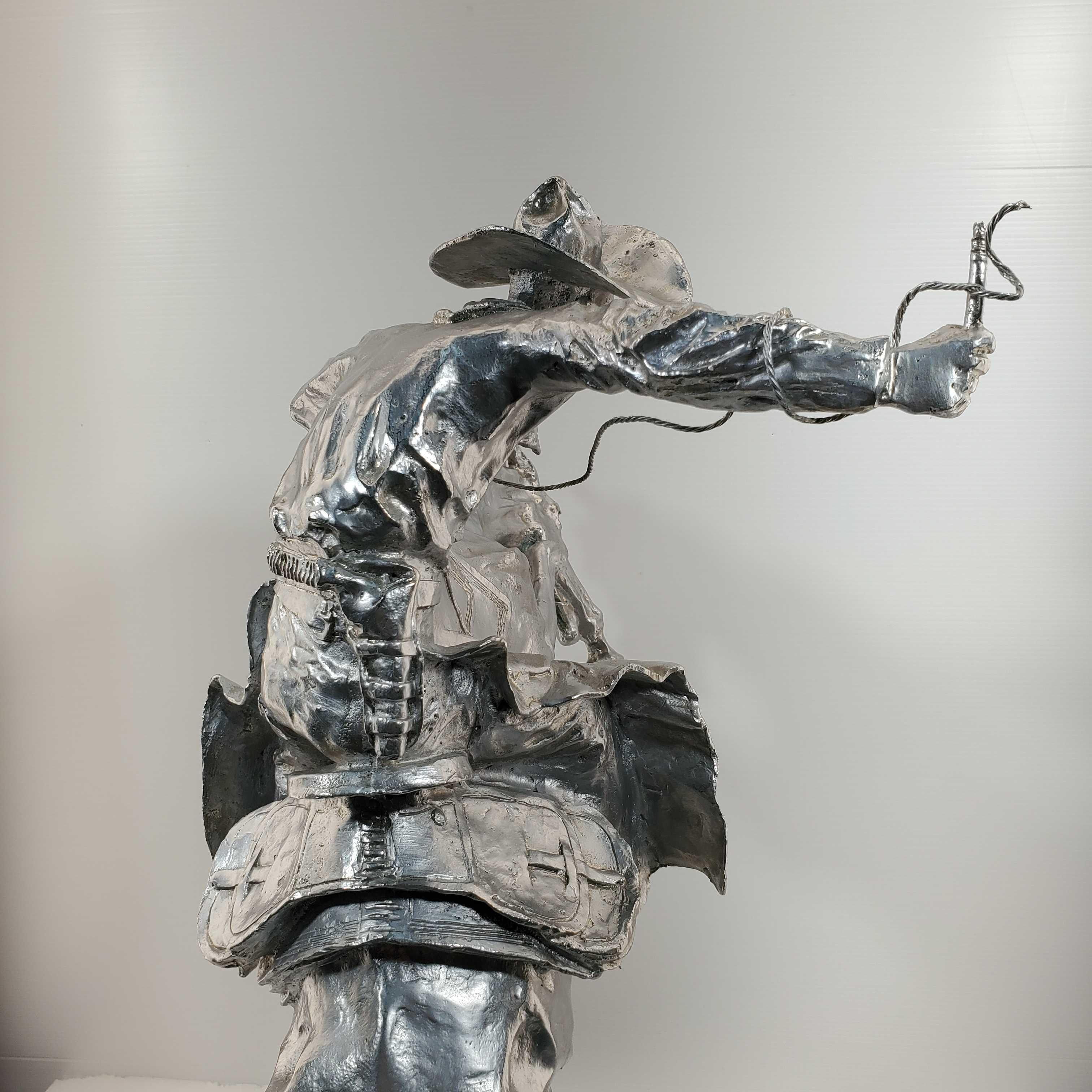 After Frederic Remington " Bronco Buster" Bronze With Silver Patina