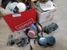 two boxes of respirators and welding glasses