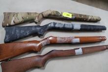 4 RUGER 10/22 STOCKS WITH DUCT TAPE RESIDUE