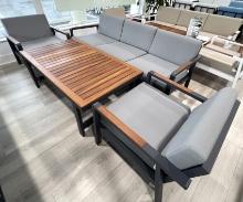 Smynra,  a 4 Piece Outoor Furniture Set with a 3 Seater Sofa, (2) Arm Side Chairs and a Teak Top Cof