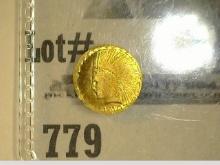 Tiny Indian design .13 gram Gold Coin in a plastic flip.