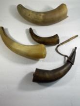 COLLECTION OF FOUR ANTIQUE POWDER HORNS