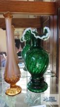 Two vases. One is a frosted swung vase and the other is a milk glass edged vase.