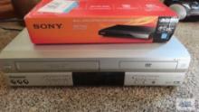 Sony DVD player in box and Panasonic VHS DVD player