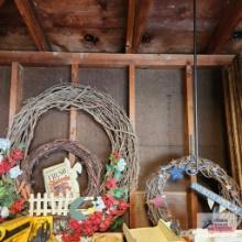 Lot of decorative wreaths, fresh strawberry metal signs and wrought iron flag holder