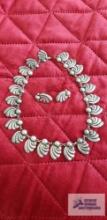 Silver colored swirl necklace marked Taxco 980 with matching screw back earrings marked silver