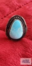 Turquoise colored teardrop shape stone in silver colored ring, no markings found