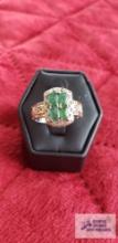 Two tone ring with four green colored stones marked 925 4.6 G (Description provided by seller)