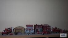Lot of assorted miniature metal ornament buildings, ornament fire trucks, and other miniature