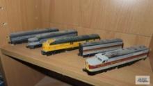 Four lifelike N gauge locomotives and one luggage car