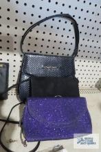 Purple and black clutch bags and purse