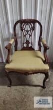 Antique armchair with ornate frame