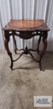 Antique carved ornate mahogany stand. 30 in. tall by 25 in. square