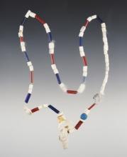 21" Strand with purple and white shell beads, red and blue glass bead types. Lima, New York.