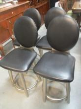 Four Black Vinyl Brushed Chrome Swiveling Bar Chairs