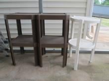 White Round and Two Brown Hard Plastic Stacking Tables