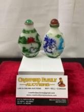 Pair of Chinese Beijing Glass snuff bottles, overlaid with multiple colors