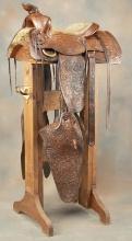 Highly tooled Saddle marked "Russ Vaughan, Reno, Nev.", 14" seat, double rig with impressive 21" mon