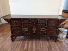 KOREAN BRASS ACCENTED BUFFET/SIDEBOARD. FEATURES MULTIPLE DRAWERS AND SINGLE CABINET.